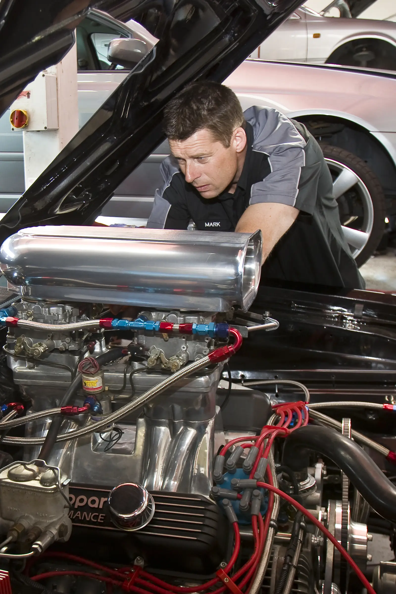 Mark working on a polished performance engine