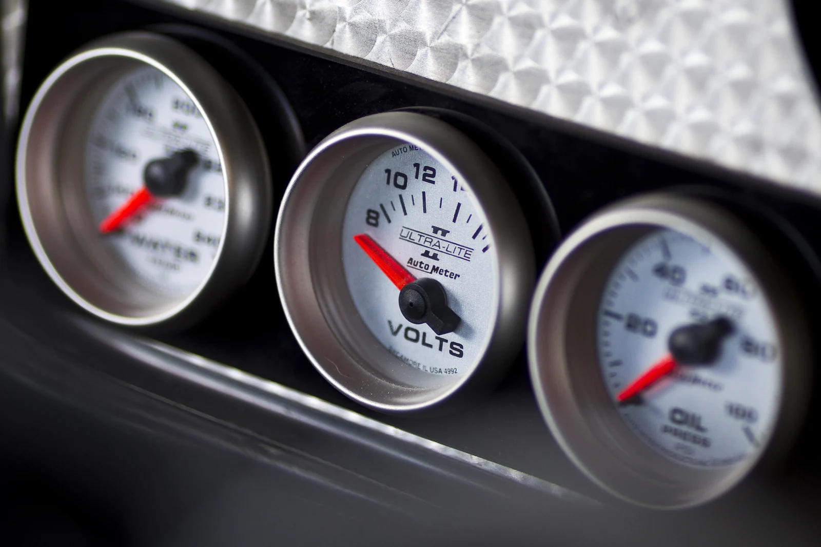 Close-up of Auto Meter gauges in a custom dash
