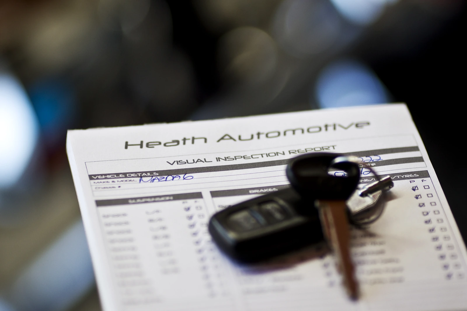 Heath Automotive visual inspection report with car keys